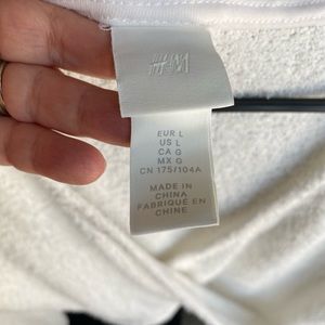 White long sleeve crop top. Fuzzy, soft, and stretch material